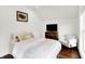 Charming bedroom featuring a TV, hardwood floors, and comfortable seating at 1434 Laurel St, Indianapolis, IN 46203