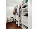 Walk-in closet features custom shelving and hardwood floors at 1434 Laurel St, Indianapolis, IN 46203