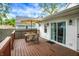 The deck features a patio set, and sliding glass door entering into the home at 1434 Laurel St, Indianapolis, IN 46203