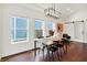 Stylish dining room with modern light fixture, hardwood floors, and views of the backyard, perfect for Gathering meals at 1434 Laurel St, Indianapolis, IN 46203