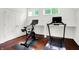 Exercise room featuring wood floors and natural light streaming through the windows at 1434 Laurel St, Indianapolis, IN 46203