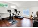 Bright exercise room with hardwood floors and windows overlooking mature trees at 1434 Laurel St, Indianapolis, IN 46203