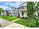 Charming two-story home with balcony, inviting entrance and a lovely landscaped front lawn at 1434 Laurel St, Indianapolis, IN 46203