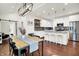 Open-concept dining and kitchen area with modern lighting and stainless steel appliances, perfect for entertaining at 1434 Laurel St, Indianapolis, IN 46203