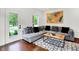 Stylish living room featuring a comfortable sofa, decorative rug, and modern art at 1434 Laurel St, Indianapolis, IN 46203
