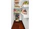 Well-organized pantry featuring ample shelving with an assortment of food items and a wine rack at 1434 Laurel St, Indianapolis, IN 46203
