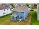 Aerial view of a home highlighting the backyard, patio, and roof within a residential neighborhood at 1464 Buckland Ct, Avon, IN 46123