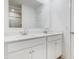 A bright bathroom vanity features double sinks, modern fixtures, and a large mirror at 1464 Buckland Ct, Avon, IN 46123