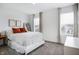 This bedroom features a large bed, natural lighting, and simple decor at 1464 Buckland Ct, Avon, IN 46123