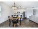 Bright, open-concept kitchen with stainless steel appliances and an adjacent dining area with modern lighting at 1464 Buckland Ct, Avon, IN 46123