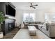 Cozy living room featuring a modern fireplace, large sectional sofa, and lots of natural light at 1464 Buckland Ct, Avon, IN 46123