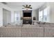 Bright living room with a modern fireplace, large sectional sofa, and lots of natural light at 1464 Buckland Ct, Avon, IN 46123