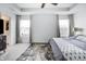 This main bedroom features an ornamental rug, ceiling fan, and windows which provide excellent light at 1464 Buckland Ct, Avon, IN 46123