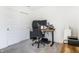 Modern home office featuring a sleek wooden desk with dual monitors and a comfortable gaming chair at 1464 Buckland Ct, Avon, IN 46123