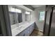 Bright bathroom features a long vanity with dual sinks, modern fixtures, and a neutral color palette at 1536 Copperwood Pl, Carmel, IN 46033