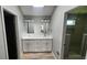 Elegant bathroom featuring double sinks, white cabinets, and modern fixtures, offering a spa-like experience at 1536 Copperwood Pl, Carmel, IN 46033