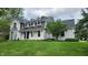 Inviting two-story home with a brick exterior, well-kept lawn, and a welcoming front entrance at 1536 Copperwood Pl, Carmel, IN 46033