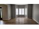 Bright and airy living room with large bay windows and hardwood floors, perfect for entertaining guests at 1536 Copperwood Pl, Carmel, IN 46033