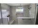 Contemporary shower featuring marble-look tile, a built-in bench and niche, plus dual shower heads at 1536 Copperwood Pl, Carmel, IN 46033
