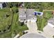 Aerial view of a home with a big yard, pool, playsets, and well-maintained landscaping at 15378 Dorman Ct, Fishers, IN 46040