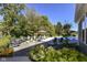 Beautiful backyard with a fire pit, lounge chairs, pool and lush landscaping at 15378 Dorman Ct, Fishers, IN 46040
