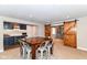 Basement dining area with bar and barn doors at 15378 Dorman Ct, Fishers, IN 46040