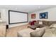 Basement entertainment area with large screen and comfortable seating at 15378 Dorman Ct, Fishers, IN 46040
