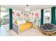 Bright bedroom showing a colorful accent wall, a chair, and a comfortable daybed at 15378 Dorman Ct, Fishers, IN 46040