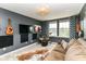 Entertainment Bonus Room: Cozy couch and musical instruments at 15378 Dorman Ct, Fishers, IN 46040