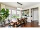 Bright dining room with hardwood floors, large windows, and modern lighting at 15378 Dorman Ct, Fishers, IN 46040