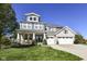 Charming two-story home featuring a welcoming front porch and a three-car garage at 15378 Dorman Ct, Fishers, IN 46040