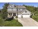 Beautiful two-story home with a three-car garage and a covered front porch at 15378 Dorman Ct, Fishers, IN 46040