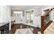 Spacious foyer boasting hardwood floors, a staircase, and a stylish rug at 15378 Dorman Ct, Fishers, IN 46040