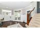 Elegant foyer featuring hardwood floors, a staircase, and access to other rooms at 15378 Dorman Ct, Fishers, IN 46040