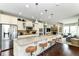 Modern kitchen featuring a large island with seating and stainless steel appliances at 15378 Dorman Ct, Fishers, IN 46040