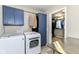 Convenient laundry room featuring a modern washer and dryer, with access to closet at 15378 Dorman Ct, Fishers, IN 46040