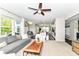 Open-concept living room with view into kitchen and comfortable seating at 15378 Dorman Ct, Fishers, IN 46040