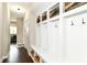 Well-organized mudroom with custom built-ins, bench seating, and ample storage at 15378 Dorman Ct, Fishers, IN 46040
