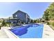 Backyard features a clear blue swimming pool, patio seating, and a well-maintained lawn at 15378 Dorman Ct, Fishers, IN 46040