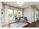 Bright sitting area with hardwood floors, a comfy chair, and lots of natural light at 15378 Dorman Ct, Fishers, IN 46040