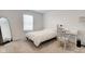 Minimalist bedroom showcasing a large mirror, window with blinds, and neutral carpet and decor at 17237 Rancorn Pl, Westfield, IN 46074