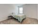 Clean bedroom with a large window, modern bedding, side table and lamp at 17237 Rancorn Pl, Westfield, IN 46074