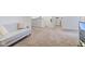 Neutral bonus room featuring a comfortable sofa, and steps to additional rooms at 17237 Rancorn Pl, Westfield, IN 46074