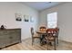 Cozy dining area with a round table, wooden chairs, and a stylish sideboard at 17237 Rancorn Pl, Westfield, IN 46074