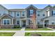 Charming townhome featuring neutral siding, brick accents, and a well-manicured lawn at 17237 Rancorn Pl, Westfield, IN 46074