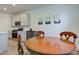 Well-lit kitchen adjacent to the dining area, featuring modern appliances and ample countertop space at 17237 Rancorn Pl, Westfield, IN 46074