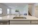 Bright, open concept kitchen with a large island, stainless steel appliances, and a view of the living area at 17237 Rancorn Pl, Westfield, IN 46074