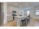 Bright kitchen with a center island, stainless steel appliances, and easy access to dining area at 17237 Rancorn Pl, Westfield, IN 46074