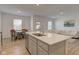 Open concept kitchen with a large island that flows into the dining and living areas at 17237 Rancorn Pl, Westfield, IN 46074