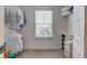 Walk-in closet with shelving, hanging rods, a window, and carpeted flooring at 17237 Rancorn Pl, Westfield, IN 46074